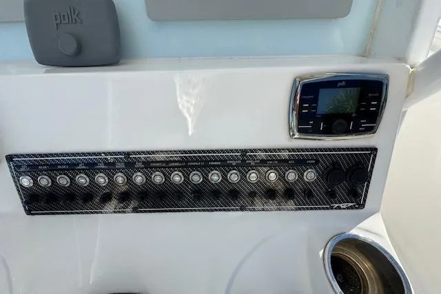 Slide: The Image of Control panel of 2015 Tidewater 280 CC Adventure boat with buttons and display. - 20