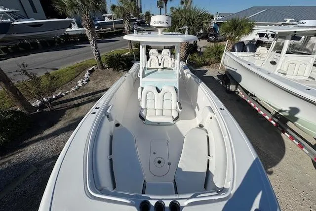 Slide: The Image of 2015 Tidewater 280 CC Adventure boat with spacious deck and Garmin equipment. - 7