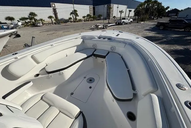 Slide: The Image of 2015 Tidewater 280 CC Adventure boat with spacious seating and sleek design. - 8