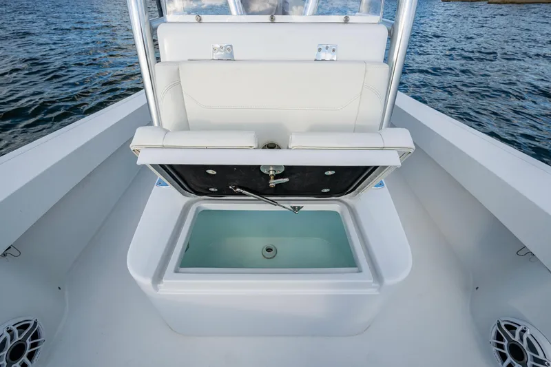 Slide: The Image of 2022 Conch 25 boat with open storage compartment on deck. - 11