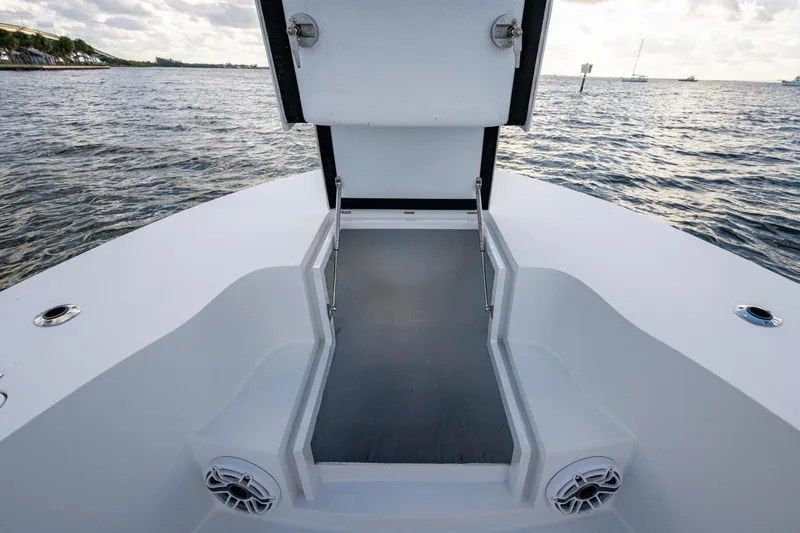Slide: The Image of 2022 Conch 25 boat deck with open hatch, ocean view in background. - 13