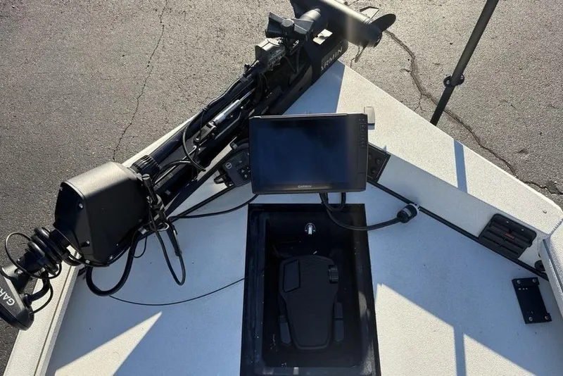 Slide: The Image of 2024 Ranger RB200 boat deck with Garmin electronics and trolling motor. - 10