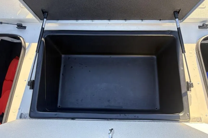 Slide: The Image of Open storage compartment in 2024 Ranger RB200 boat, showcasing spacious interior. - 13