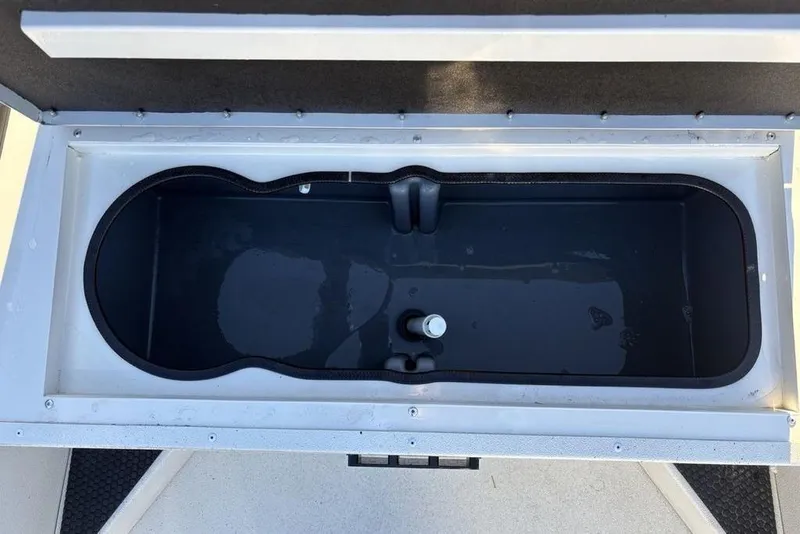 Slide: The Image of Livewell compartment in 2024 Ranger RB200 boat, partially filled with water. - 14