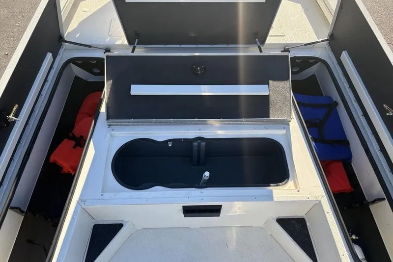 Slide: The Image of 2024 Ranger RB200 boat interior with storage compartments and life jackets. - 15