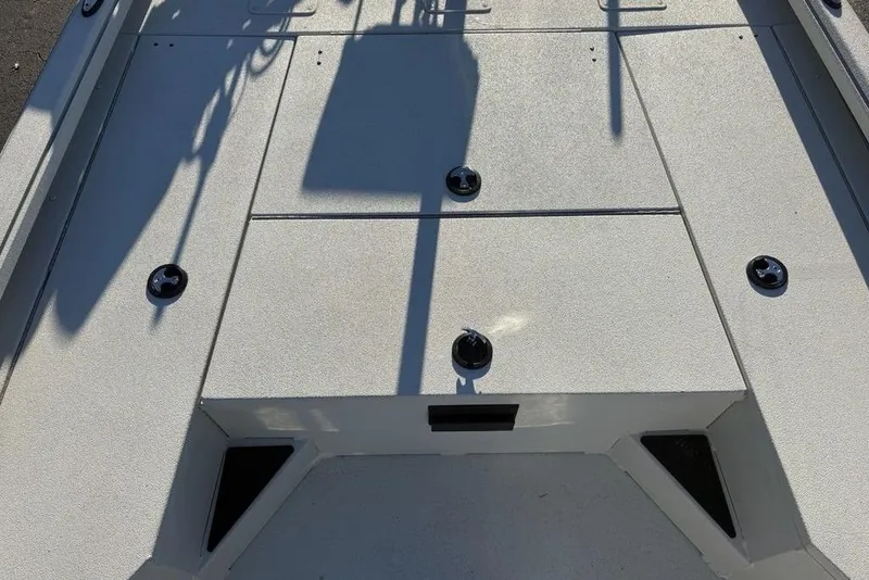 Slide: The Image of 2024 Ranger RB200 boat deck with storage compartments and fixtures. - 17