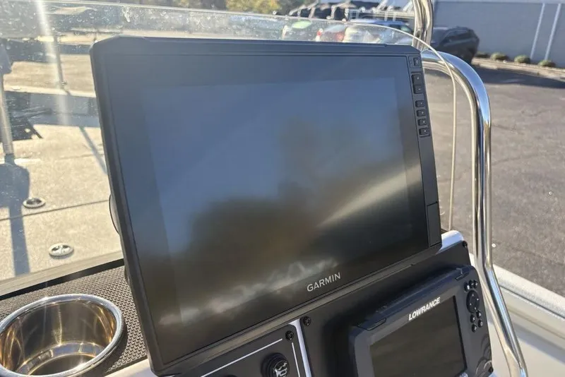 Slide: The Image of 2024 Ranger RB200 boat dashboard with Garmin and Lowrance navigation displays. - 24