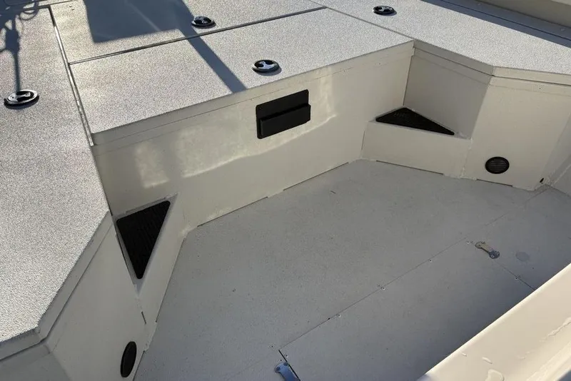 Slide: The Image of 2024 Ranger RB200 boat interior with storage compartments and non-slip flooring. - 25