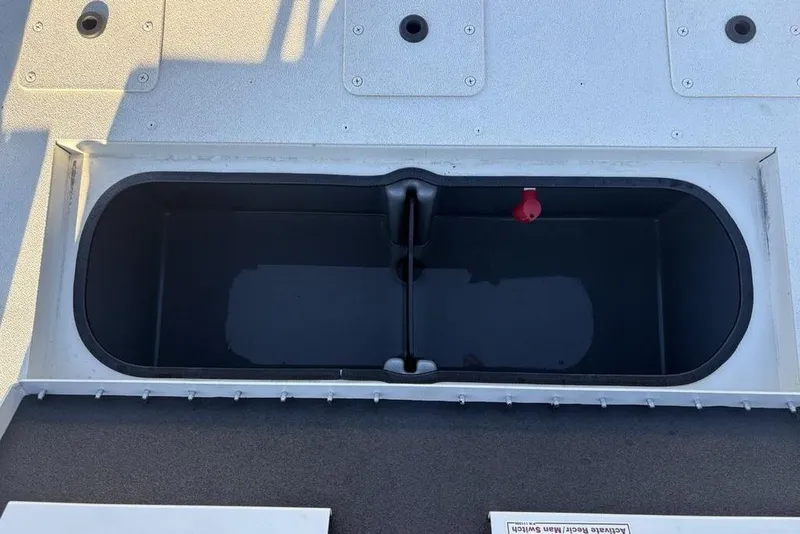 Slide: The Image of 2024 Ranger RB200 boat livewell with open lid, showcasing interior design. - 29