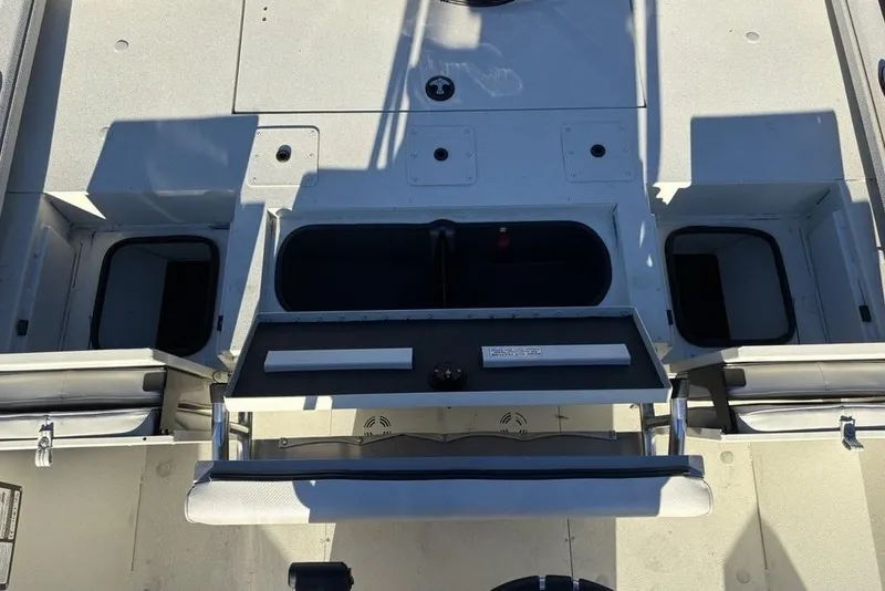 Slide: The Image of 2024 Ranger RB200 boat interior with storage compartments and seating. - 33