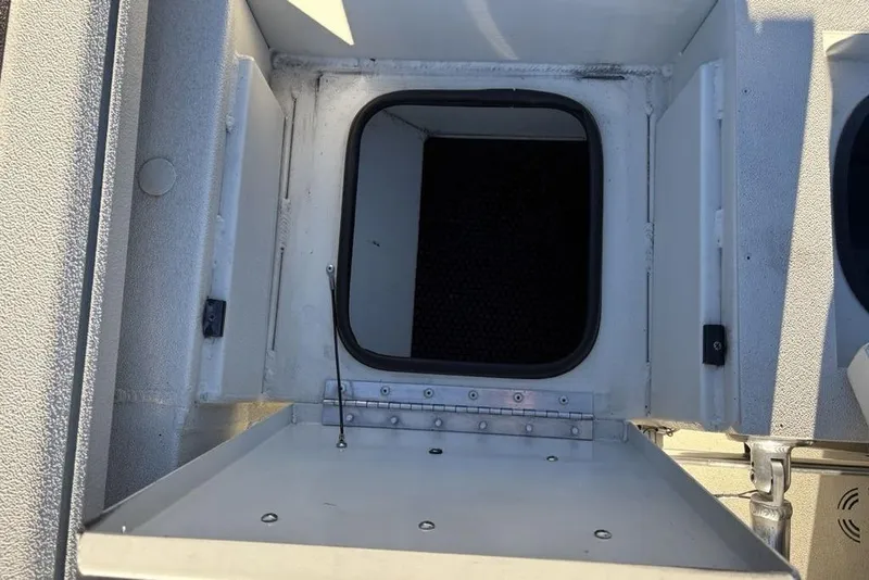 Slide: The Image of 2024 Ranger RB200 boat storage compartment with open hatch, showcasing interior details. - 36