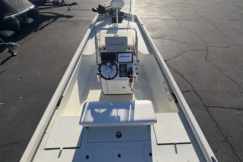 Slide: The Image of 2024 Ranger RB200 boat interior with Garmin and Lowrance equipment, parked on asphalt. - 38