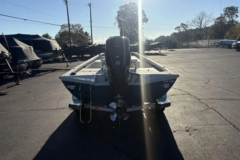 Slide: The Image of 2024 Ranger RB200 boat on trailer in sunny outdoor setting. - 5