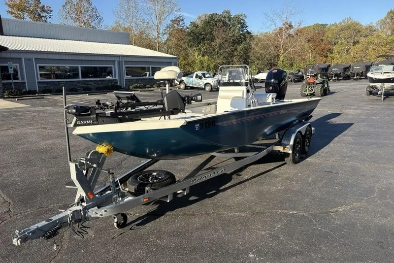 Slide: The Image of 2024 Ranger RB200 boat on trailer in dealership parking lot. - 8