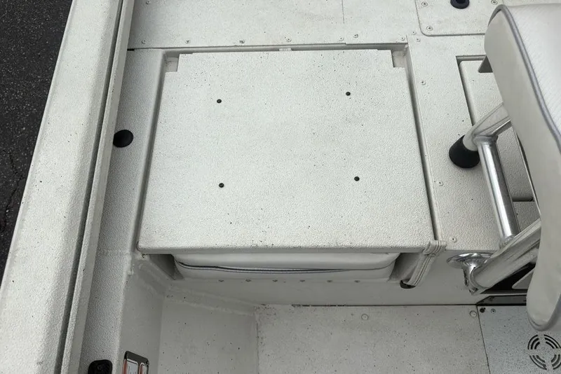 Slide: The Image of 2022 Ranger RB200 boat interior with white seating and storage compartment. - 15