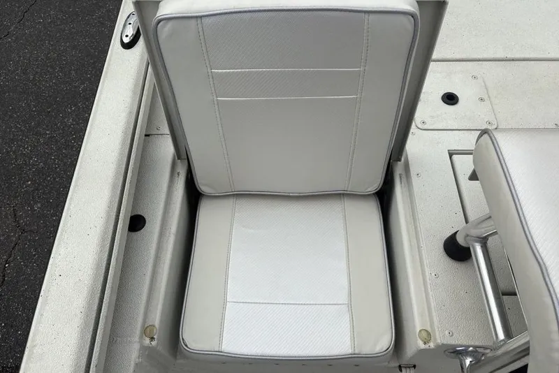 Slide: The Image of 2022 Ranger RB200 boat seat with white upholstery and sleek design. - 17