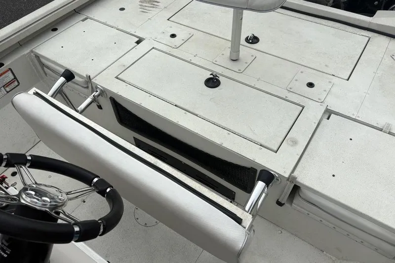 Slide: The Image of 2022 Ranger RB200 boat interior with steering wheel and storage compartments. - 19