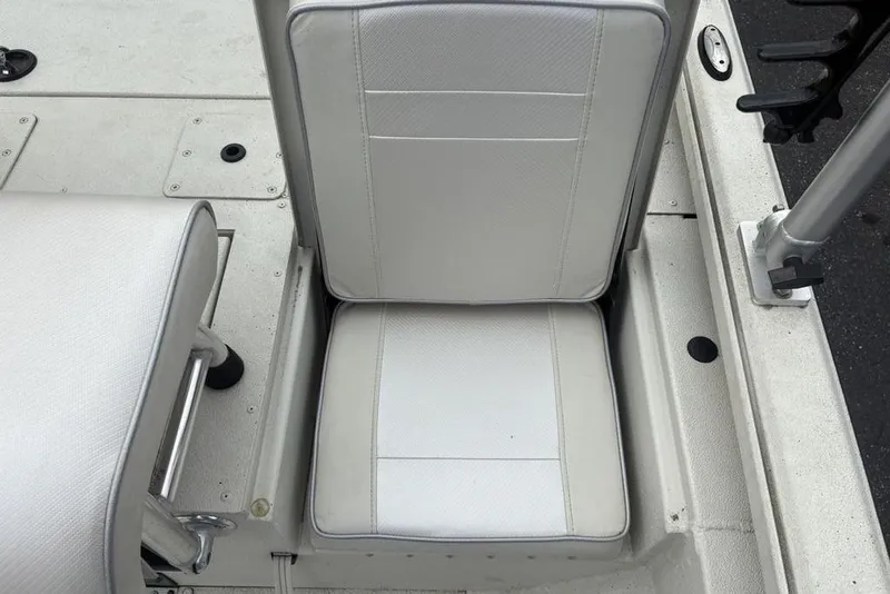 Slide: The Image of 2022 Ranger RB200 boat seat with white upholstery and metal frame. - 20