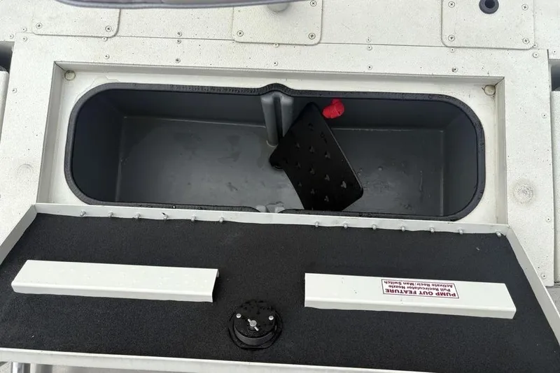 Slide: The Image of Open storage compartment in 2022 Ranger RB200 boat. - 21