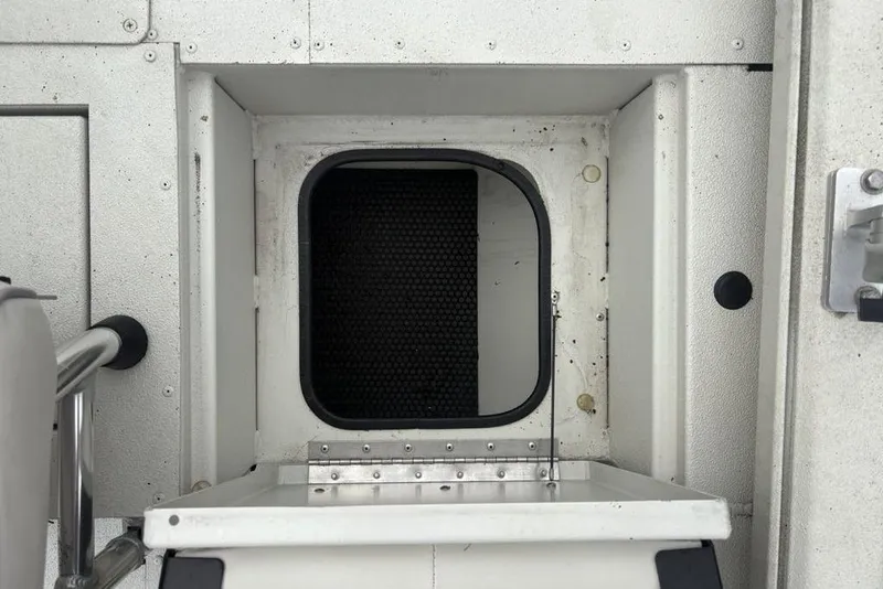 Slide: The Image of Hatch opening on a 2022 Ranger RB200 boat, featuring a textured interior. - 25