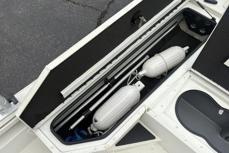 Slide: The Image of 2022 Ranger RB200 boat storage compartment with fenders and equipment. - 3