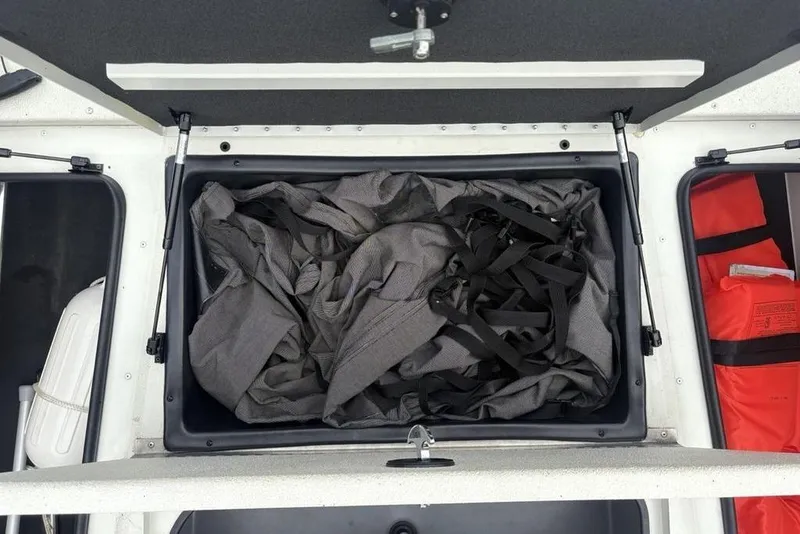 Slide: The Image of Storage compartment in 2022 Ranger RB200 boat with gear and life jackets. - 4