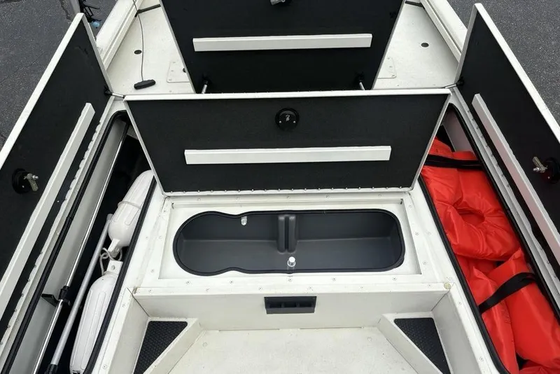 Slide: The Image of 2022 Ranger RB200 boat storage compartments with life jackets and equipment. - 6