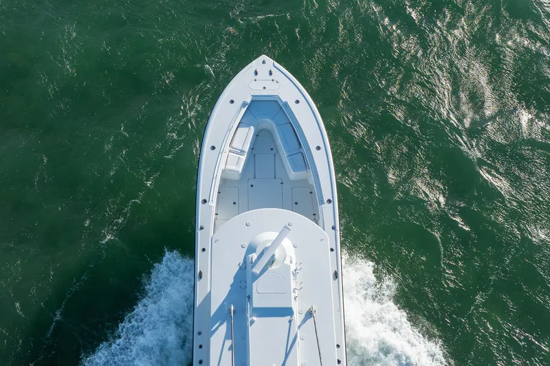 Slide: The Image of Aerial view of 2022 Yellowfin 39 Offshore boat cruising on the ocean. - 12