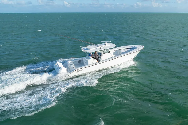 Slide: The Image of 2022 Yellowfin 39 Offshore boat cruising on open sea under clear skies. - 13