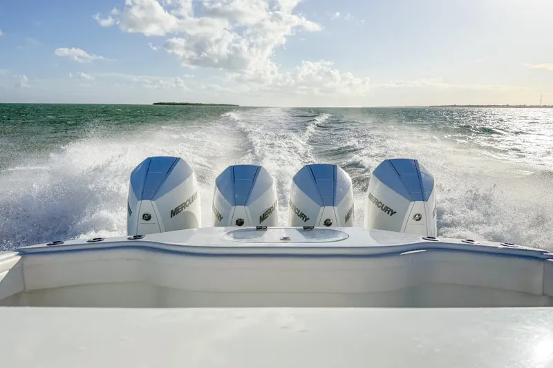 Slide: The Image of 2022 Yellowfin 39 Offshore boat with four Mercury engines cruising on open water. - 15