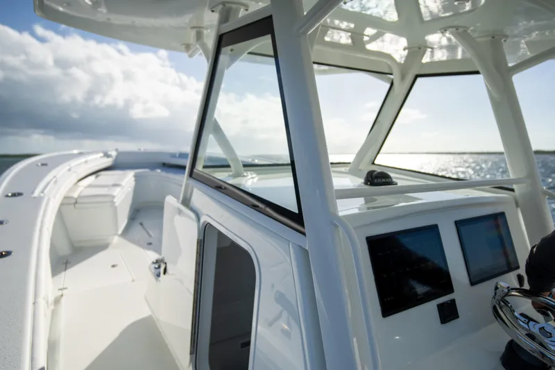 Slide: The Image of 2022 Yellowfin 39 Offshore boat with sleek design and modern cockpit on open water. - 22