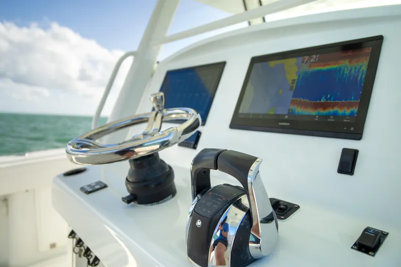 Slide: The Image of 2022 Yellowfin 39 Offshore helm with advanced navigation displays and controls. - 25