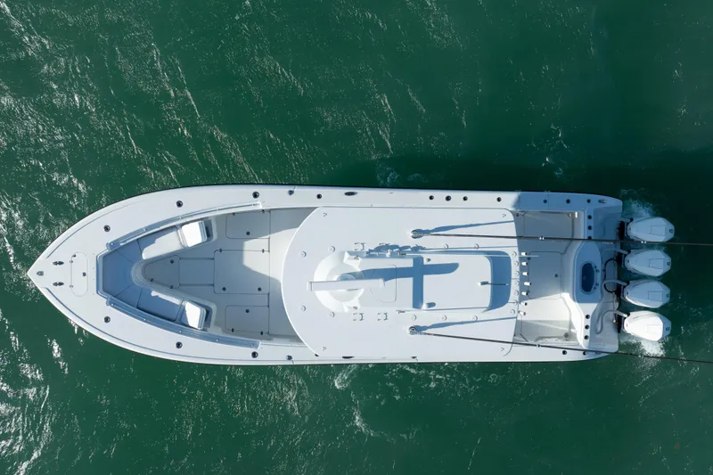Slide: The Image of Top view of 2022 Yellowfin 39 Offshore boat on green water. - 3