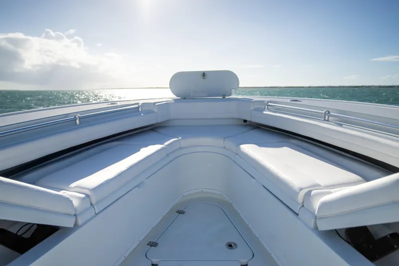 Slide: The Image of 2022 Yellowfin 39 Offshore boat interior with white seating, ocean view. - 30