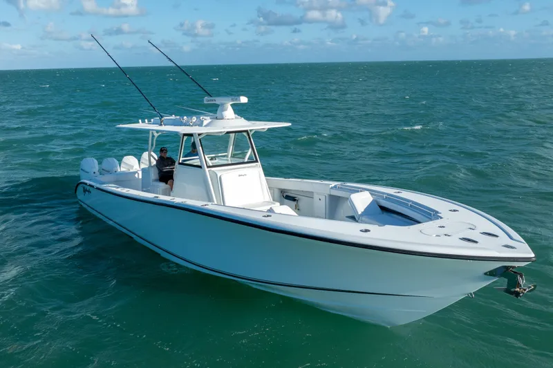Slide: The Image of 2022 Yellowfin 39 Offshore boat cruising on open sea under clear skies. - 4