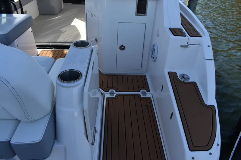Slide: The Image of 2024 Regal 36 XO boat interior with teak flooring and seating area. - 10