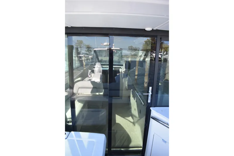 Slide: The Image of 2024 Regal 36 XO yacht with glass sliding door and interior view. - 15