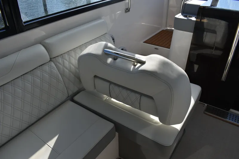 Slide: The Image of Luxurious interior seating of 2024 Regal 36 XO boat with elegant diamond stitching. - 22