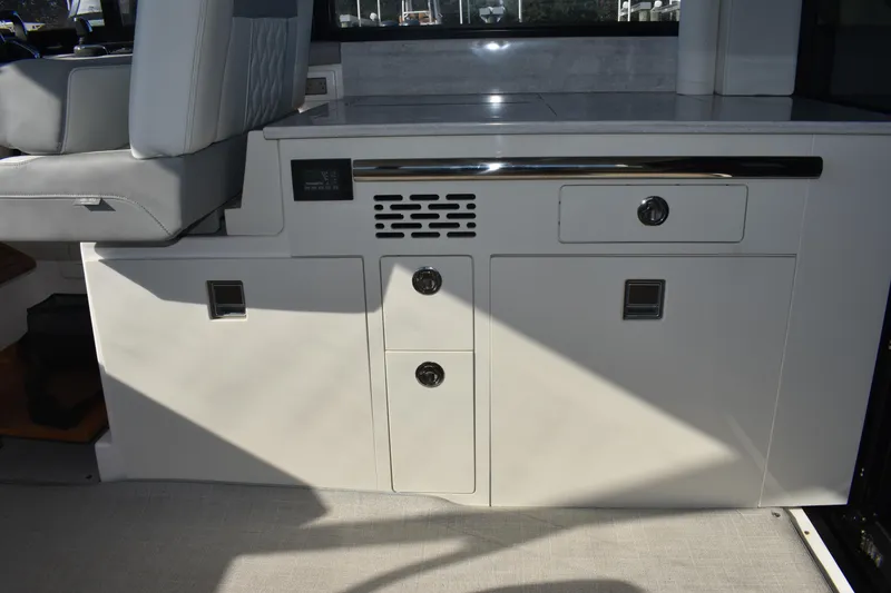 Slide: The Image of 2024 Regal 36 XO interior with sleek cabinetry and modern seating design. - 27