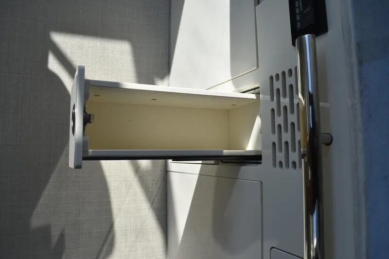 Slide: The Image of Open drawer in 2024 Regal 36 XO boat interior, showcasing sleek design and functionality. - 30