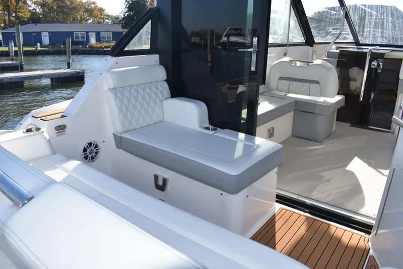 Slide: The Image of 2024 Regal 36 XO boat interior with luxurious seating and modern design. - 4