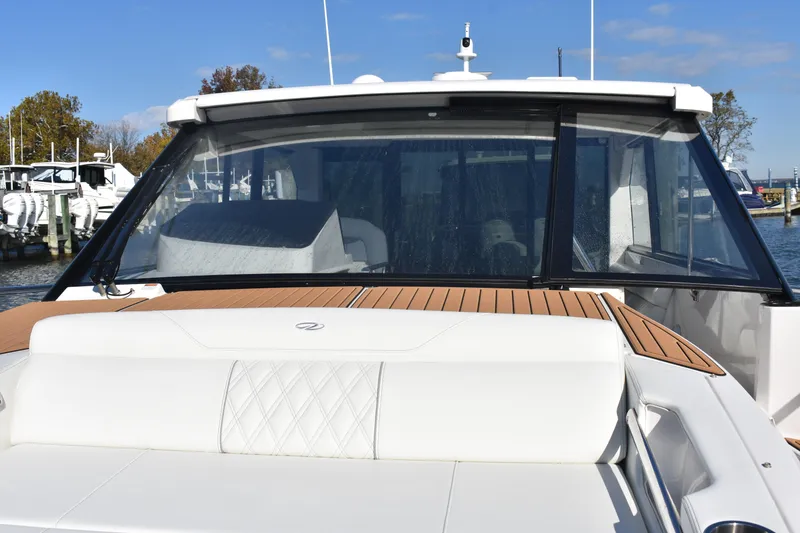 Slide: The Image of 2024 Regal 36 XO yacht with sleek design and luxurious seating. - 41