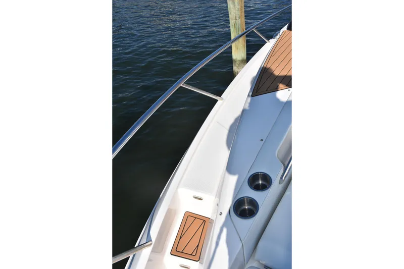 Slide: The Image of 2024 Regal 36 XO boat deck with cup holders and wood accents. - 43