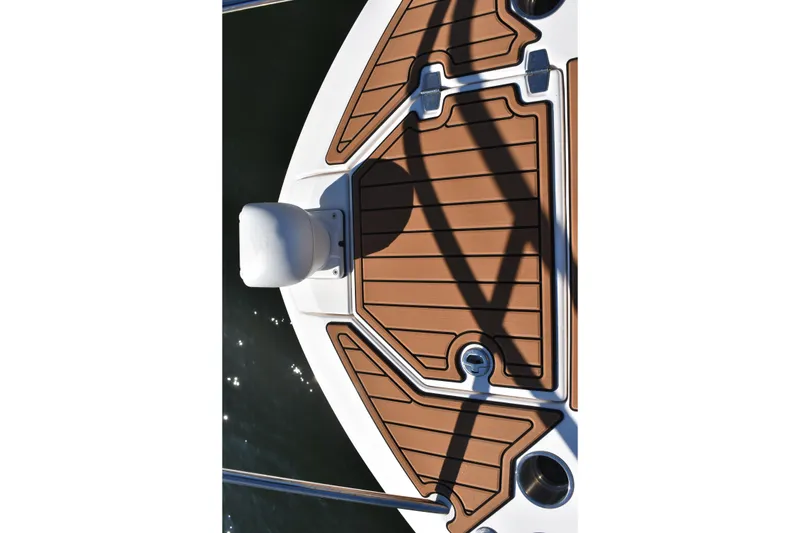 Slide: The Image of 2024 Regal 36 XO boat deck with brown and white design. - 44