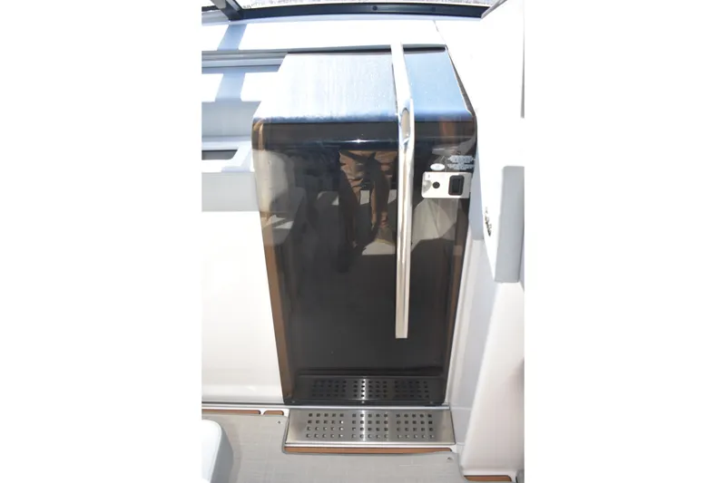 Slide: The Image of 2024 Regal 36 XO yacht interior with sleek, modern design and stainless steel accents. - 47