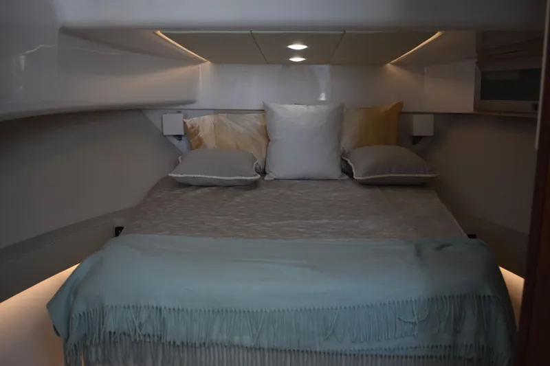 Slide: The Image of Luxurious cabin interior of 2024 Regal 36 XO yacht with cozy bedding. - 49