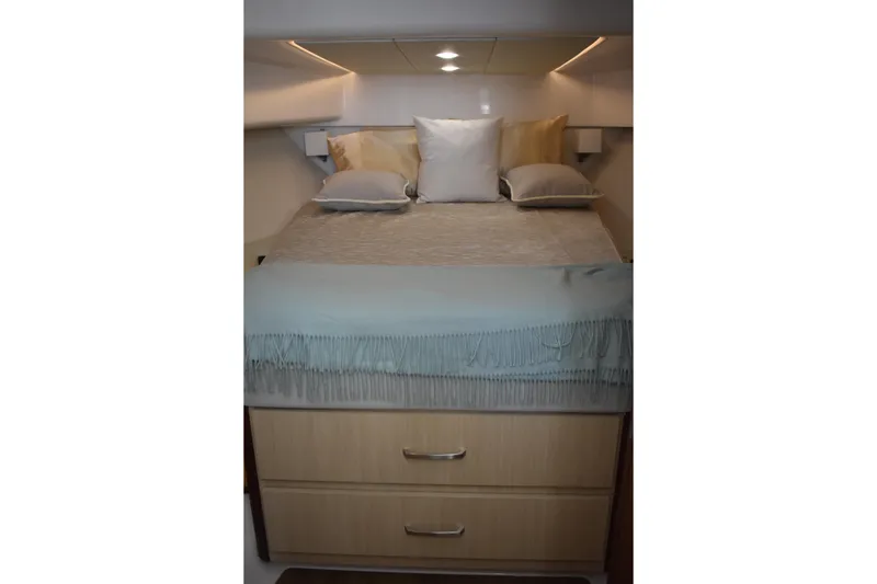 Slide: The Image of Luxurious cabin interior of 2024 Regal 36 XO yacht with elegant bedding. - 50