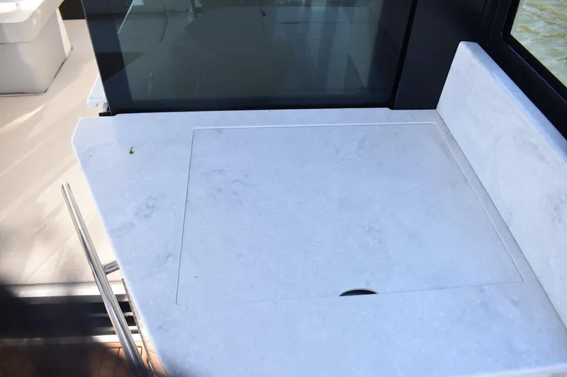 Slide: The Image of 2024 Regal 36 XO yacht interior with sleek countertop design. - 6