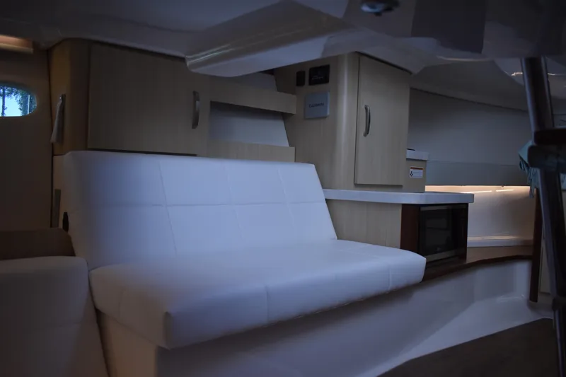 Slide: The Image of Interior of 2024 Regal 36 XO yacht with modern seating and cabinetry. - 62