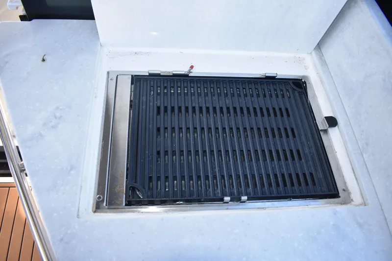 Slide: The Image of Built-in grill on 2024 Regal 36 XO yacht, featuring sleek design and functionality. - 7
